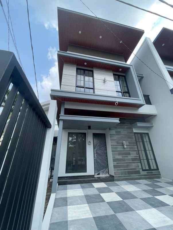 rumah manyar jaya surabaya minimalis row jalan 4 mobil
