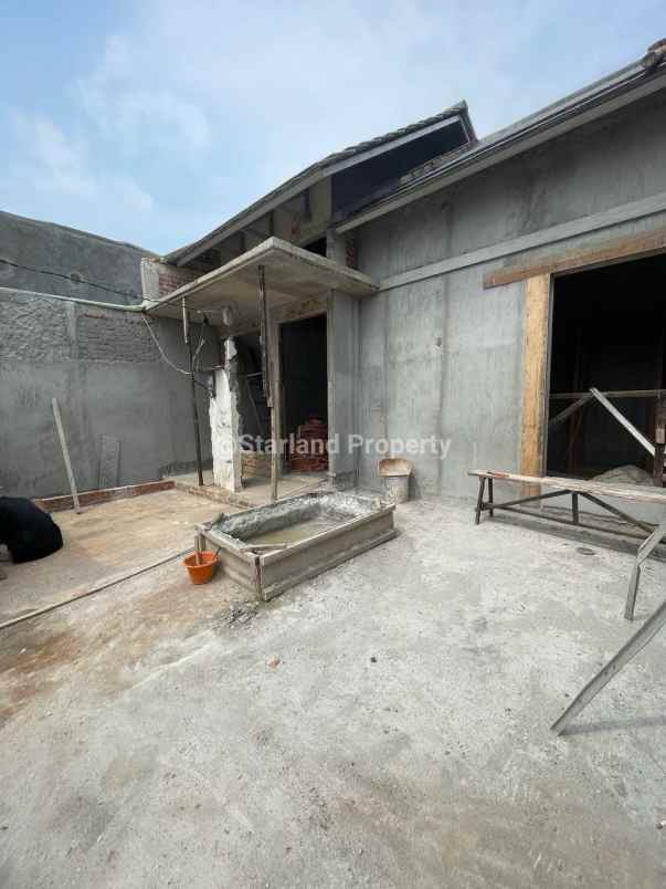 dijual rumah jalan raya tanah 100