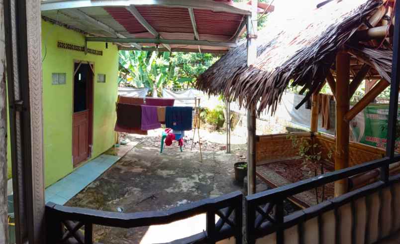 dijual rumah jl raya tonjong