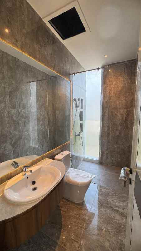 rumah new gress woodland citraland surabaya barat