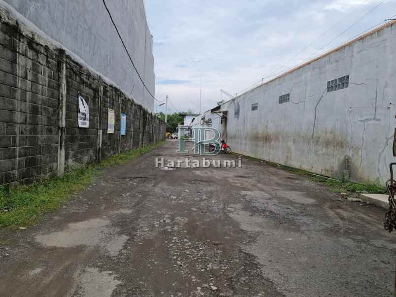 tanah gudang bonus rumah lebar depan 18m siap ajb