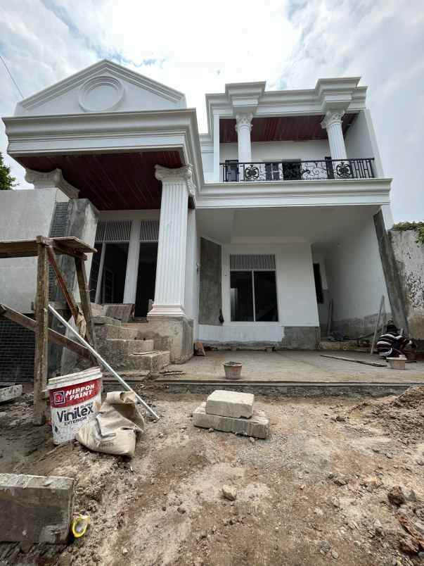 dijual rumah jalan raya komplek mega