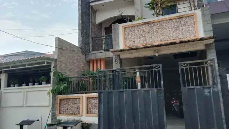 dijual rumah wiguna selatan indah