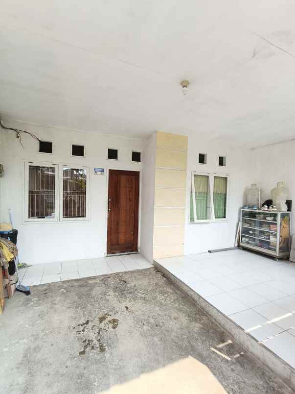 over kredit rumah taman mutiara indah 2