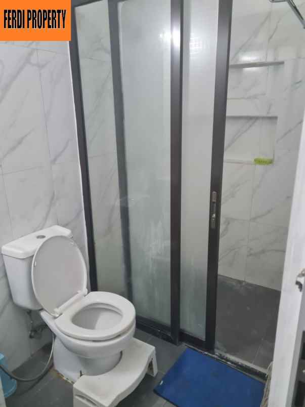 rumah canti 2 lantai raffles hills cibubur