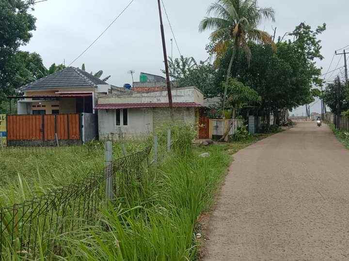 dijual rumah belakang perum telaga