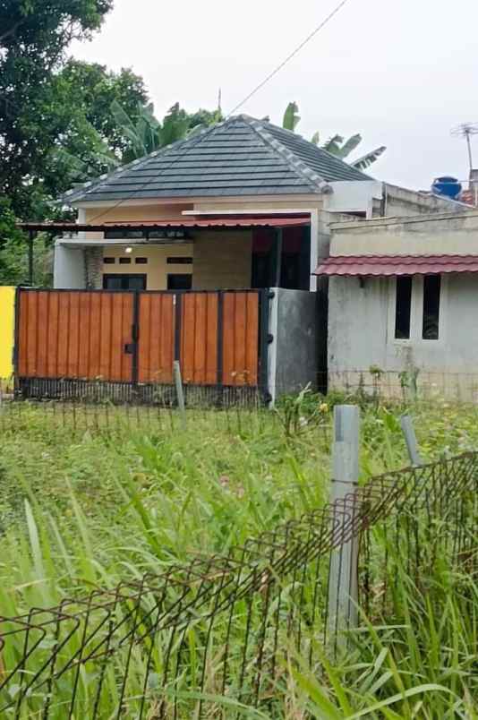 dijual rumah belakang perum telaga