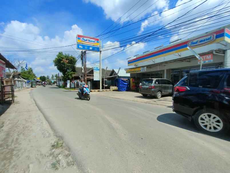 dijual tanah dan bangunan lokasi pinggir jalan sako