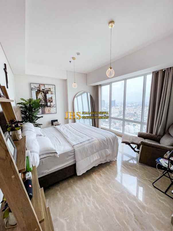 dijual apartemen podomoro city deli tower