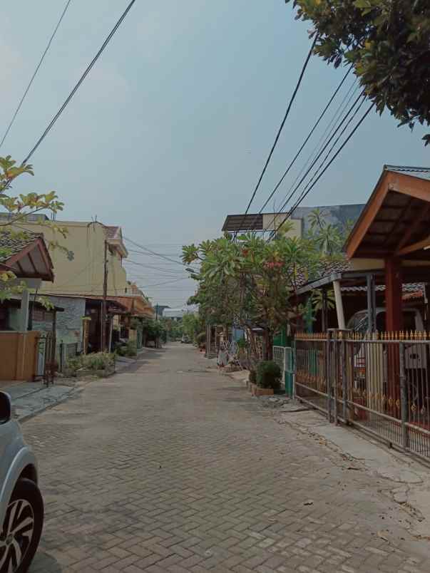 dijual rumah taman harapan baru