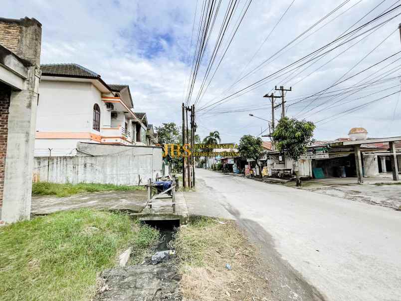 dijual tanah dan bangunan jalan amal luhur