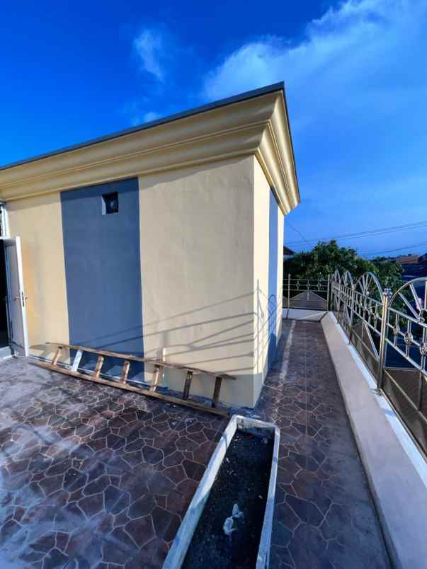 dijual rumah jalan wiguna timur