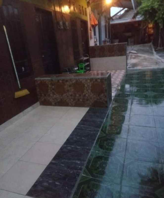 rumah sepaket dengan kontrakan 12 pintu toko 4 pintu