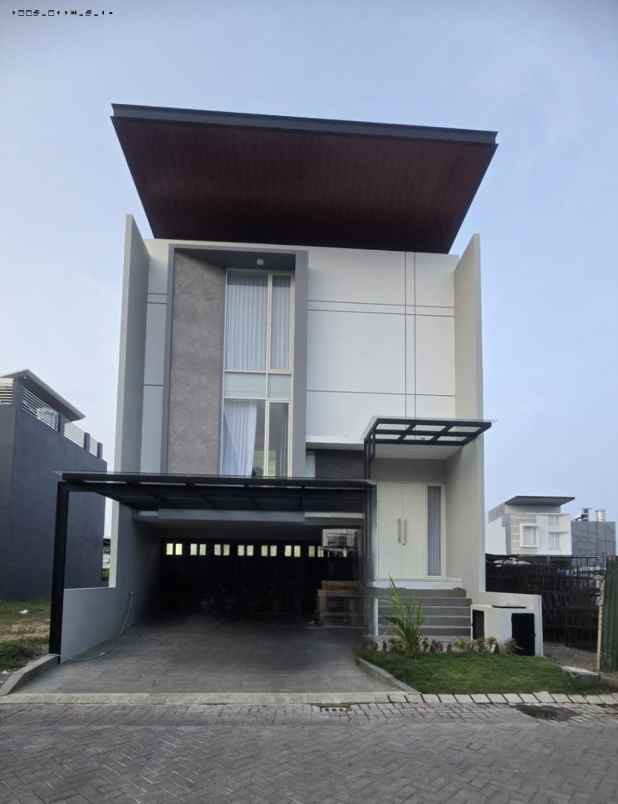 rumah grand island zuvadiva pakuwon city minimalis