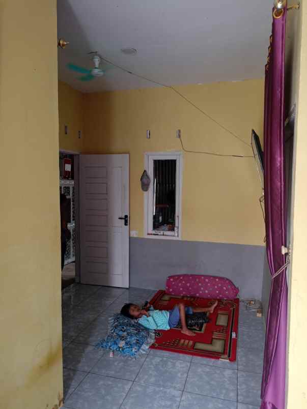 over kredit rumah subsidi jln beringin ujung air hitam