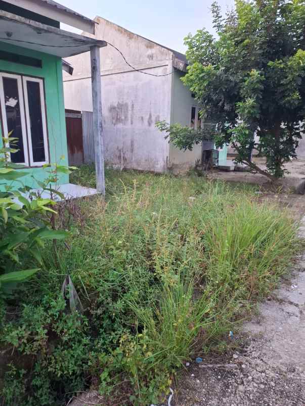 over kredit rumah jl suka karya kualu panam