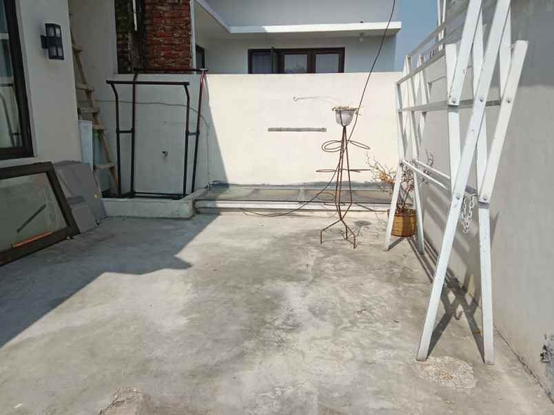 dijual rumah di dalam cluster puri