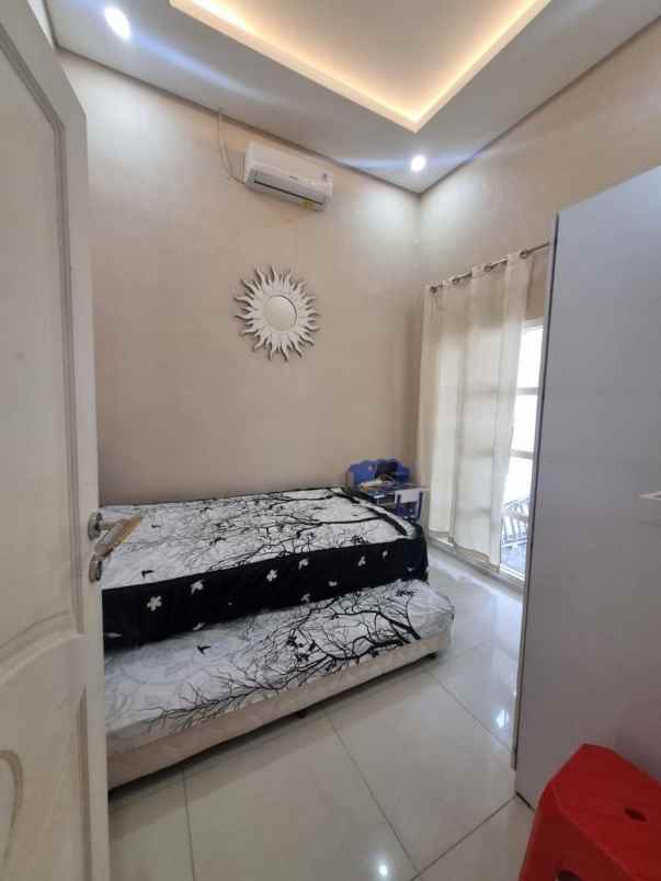 rumah 1man di pakuwon city puri asri sby