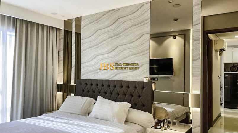 dijual apartemen the reiz condo