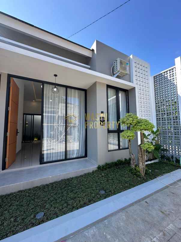 rumah modern dalam cluster di mlati sleman