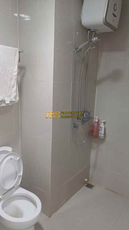 dijual apartemen podomoro city deli tower