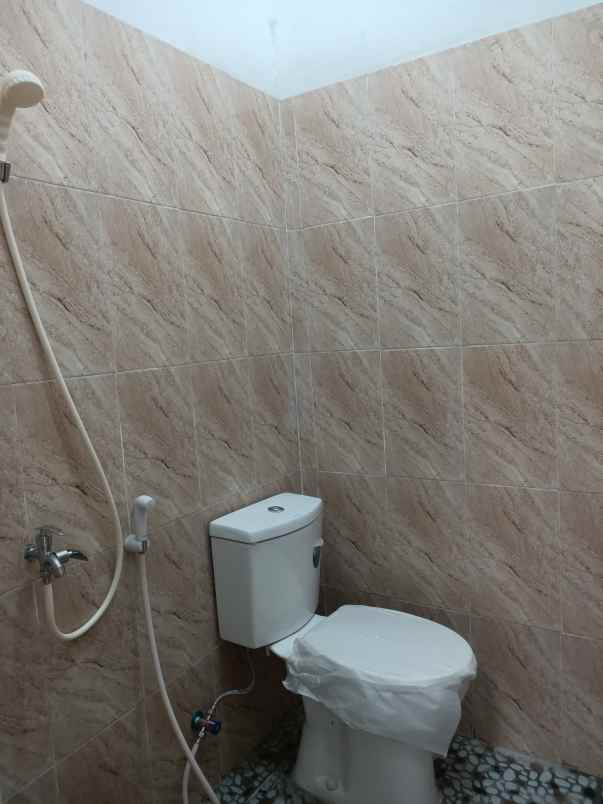 dijual rumah taman harapan baru