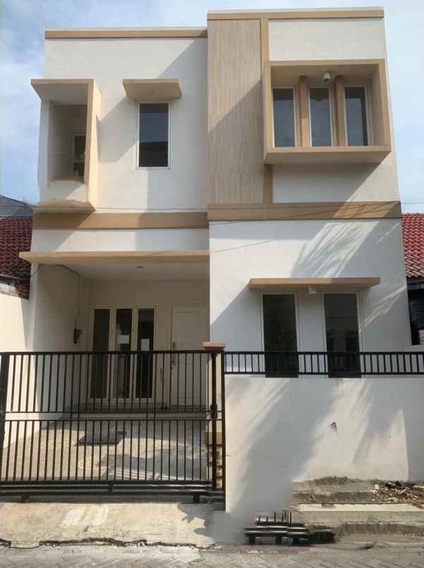 rumah griya asri hadap utara row 2 mobil