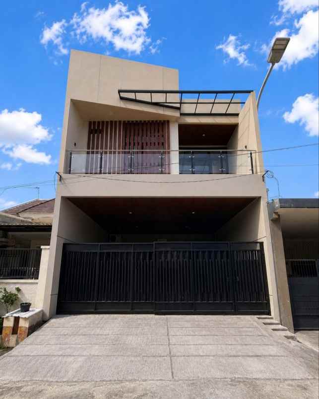 rumah babatan pantai new minimalis carport 2