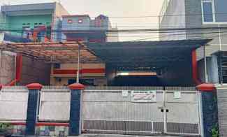 rumah 2 lantai pinggir jalan